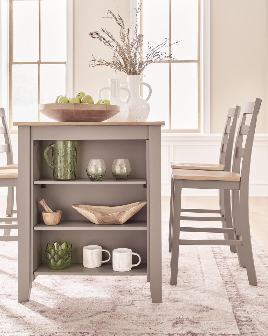 Dining counter table with gray open shelving and natural wood tabletop, styled with decor