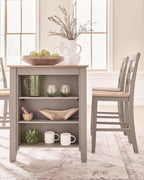 Dining counter table with gray open shelving and natural wood tabletop, styled with decor