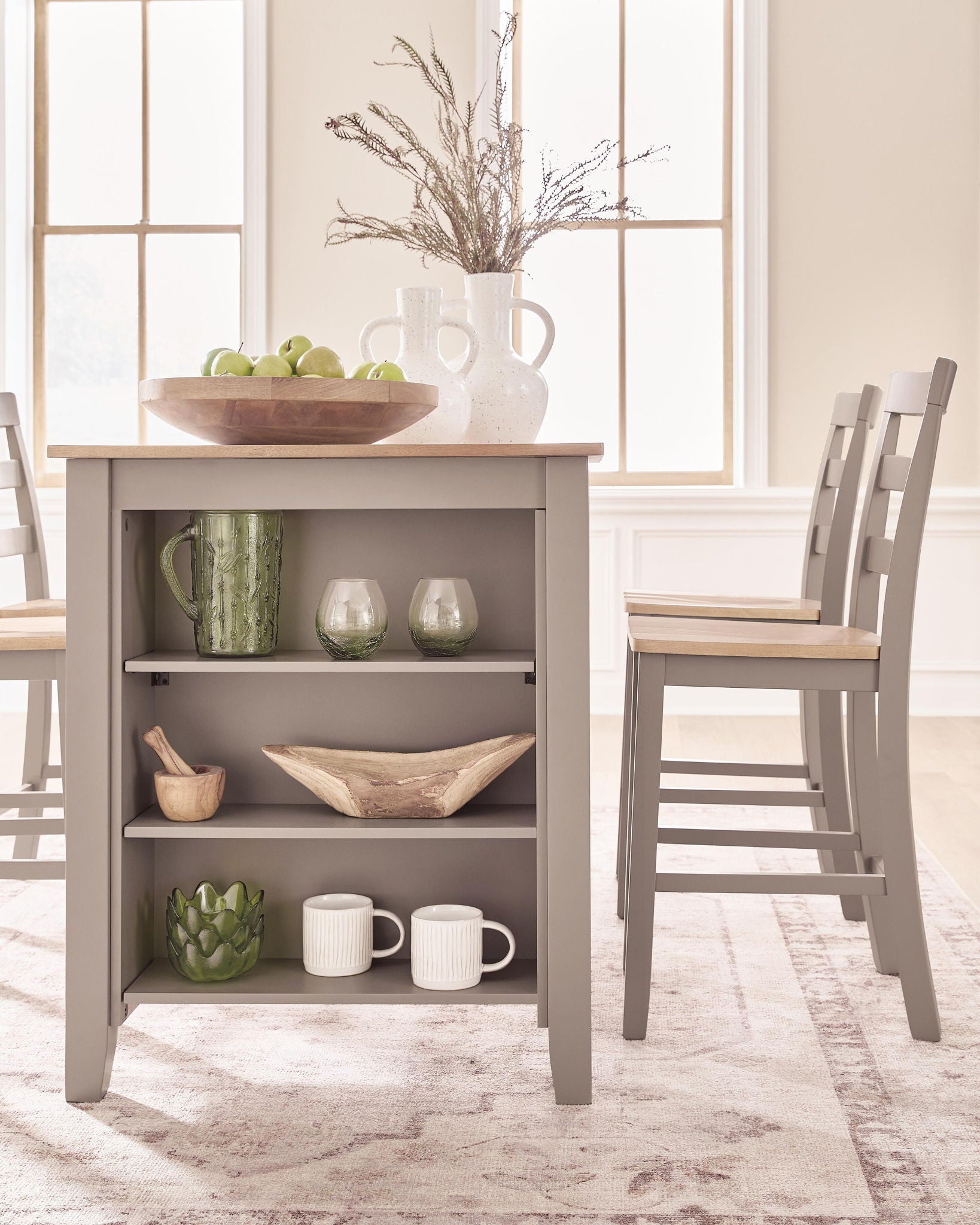 Dining counter table with gray open shelving and natural wood tabletop, styled with decor