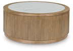 Round cocktail table with light brown fluted cylinder base and white marble-look top