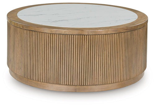 Round cocktail table with light brown fluted cylinder base and white marble-look top