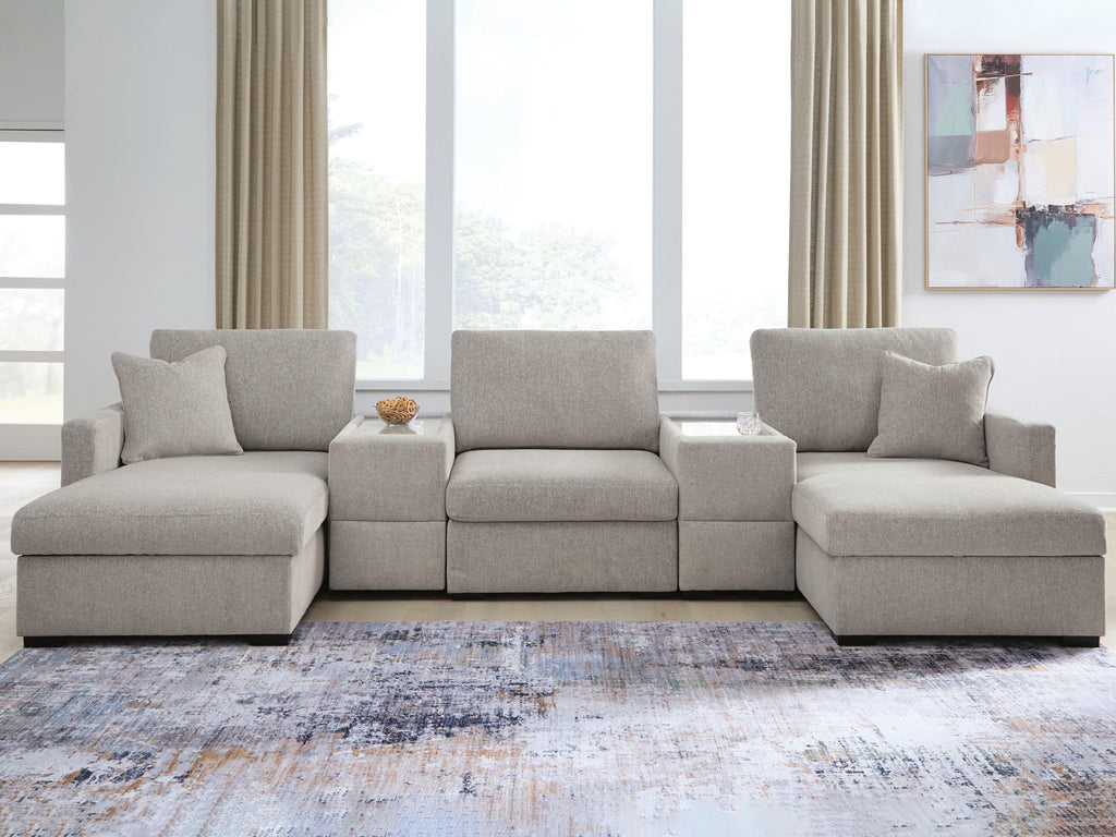 Gray sectional sofa with chaise seating and three back cushions, matching throw pillows