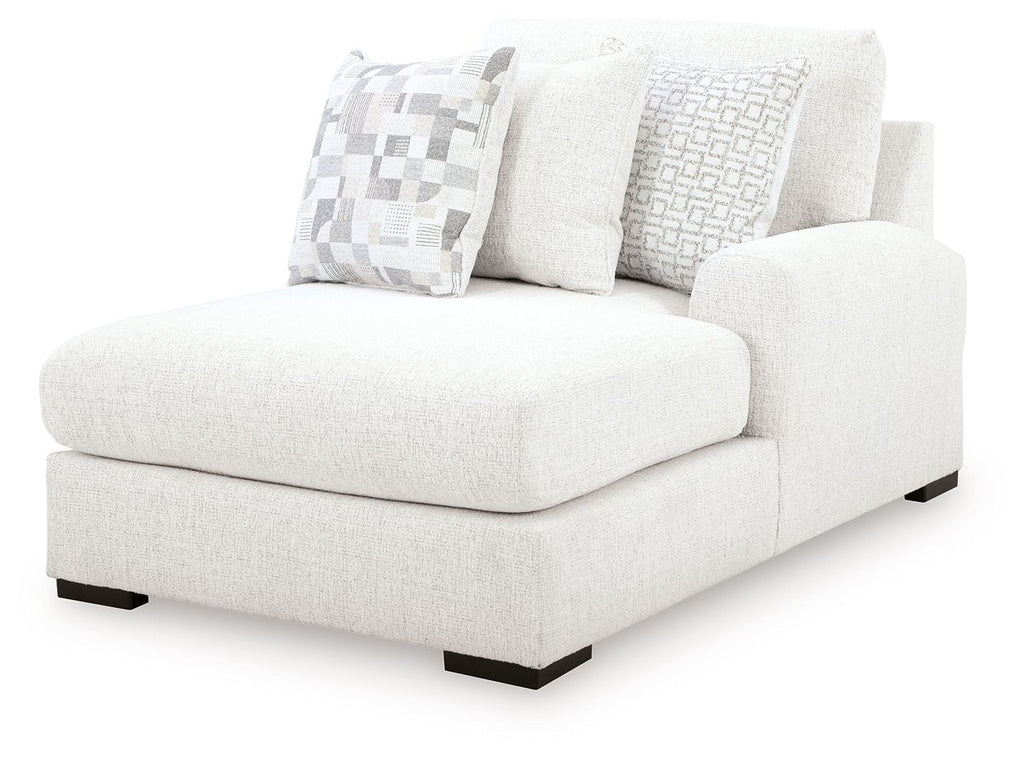 Corner chaise lounge in chalk upholstery with three cushions and black legs