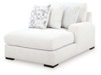 Corner chaise lounge in chalk upholstery with three cushions and black legs