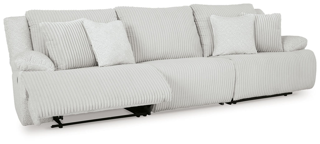 Light gray reclining sectional sofa with chaise ends and striped cushions