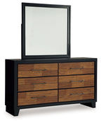 Brown wood dresser with black mirror frame, six drawers and silver pull handles