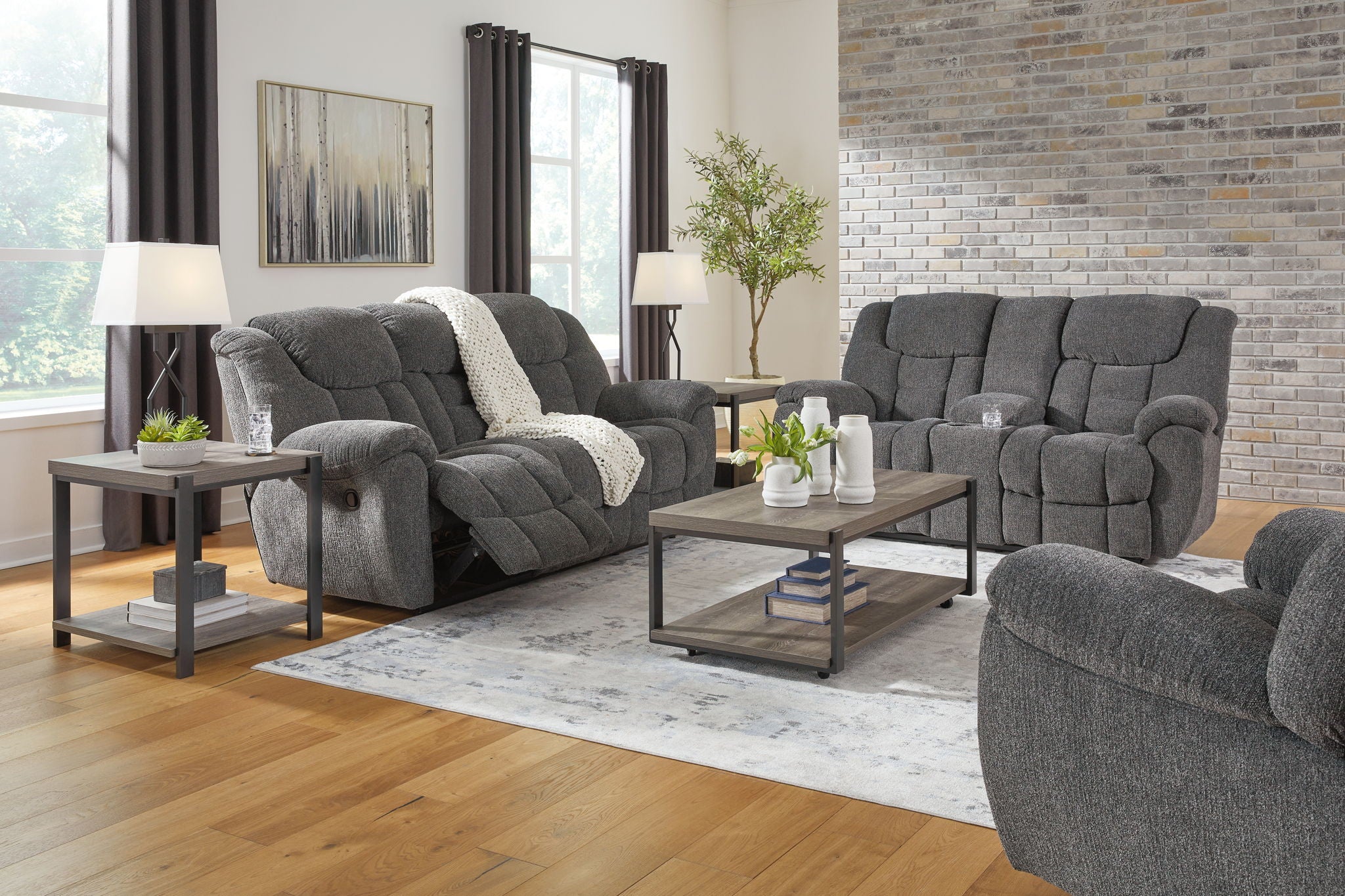 Dark gray reclining seating set with tufted upholstery: sofa, loveseat, and recliner