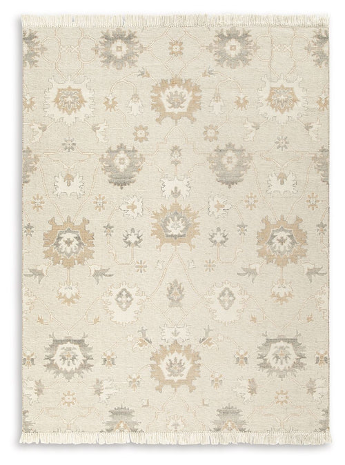 Beige rug with light ornate pattern and fringed edges, full view