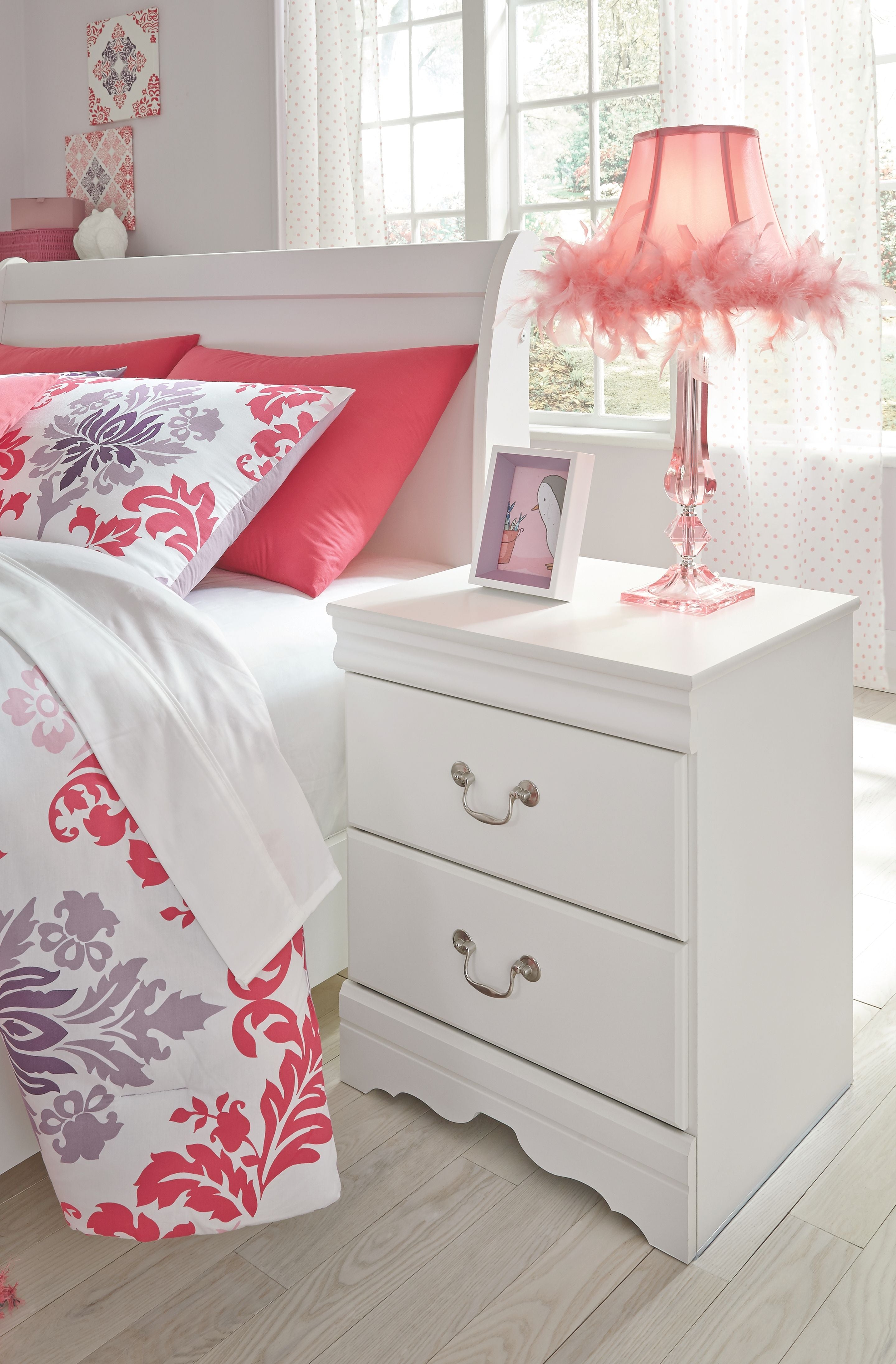 White two-drawer nightstand with two drawer handles and scalloped bottom