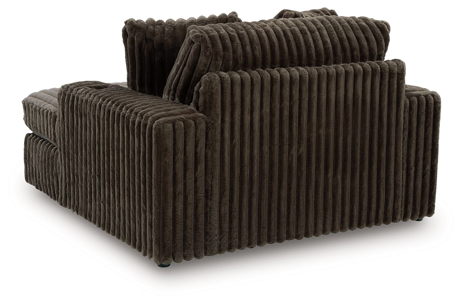 Oversized chaise with ribbed dark fabric, rounded arm blocks and layered back pillows.