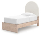 Upholstered panel bed with beige headboard, white mattress, and light wood base