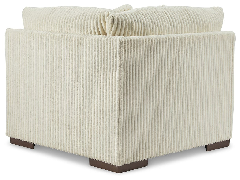 Ivory ribbed fabric wedge sectional chair with button-tufted back