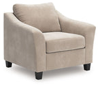 Taupe chair-and-a-half armchair with upholstered arms and cushioned seat, black feet