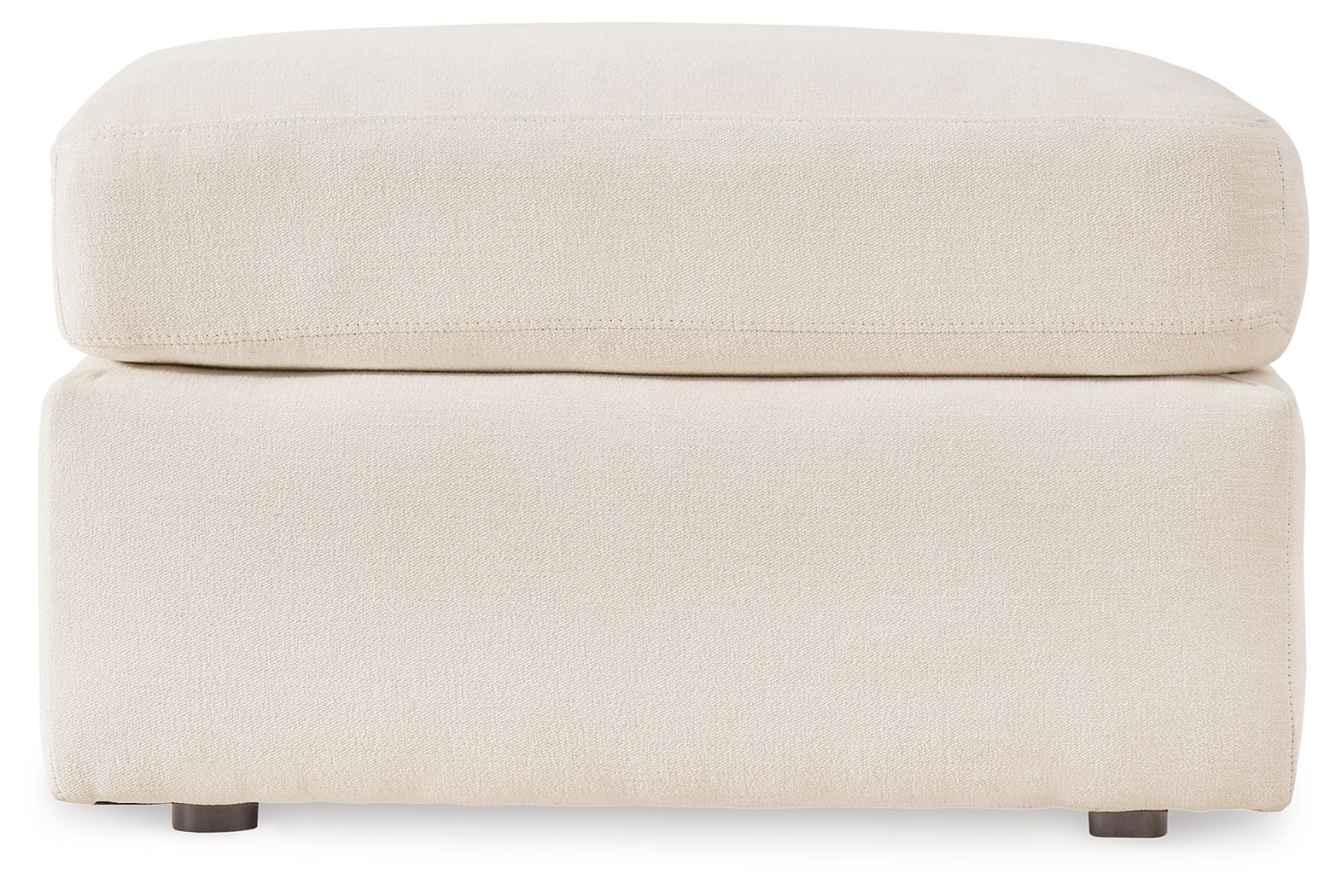 Cream accent ottoman with cushioned top and square base, low dark legs.