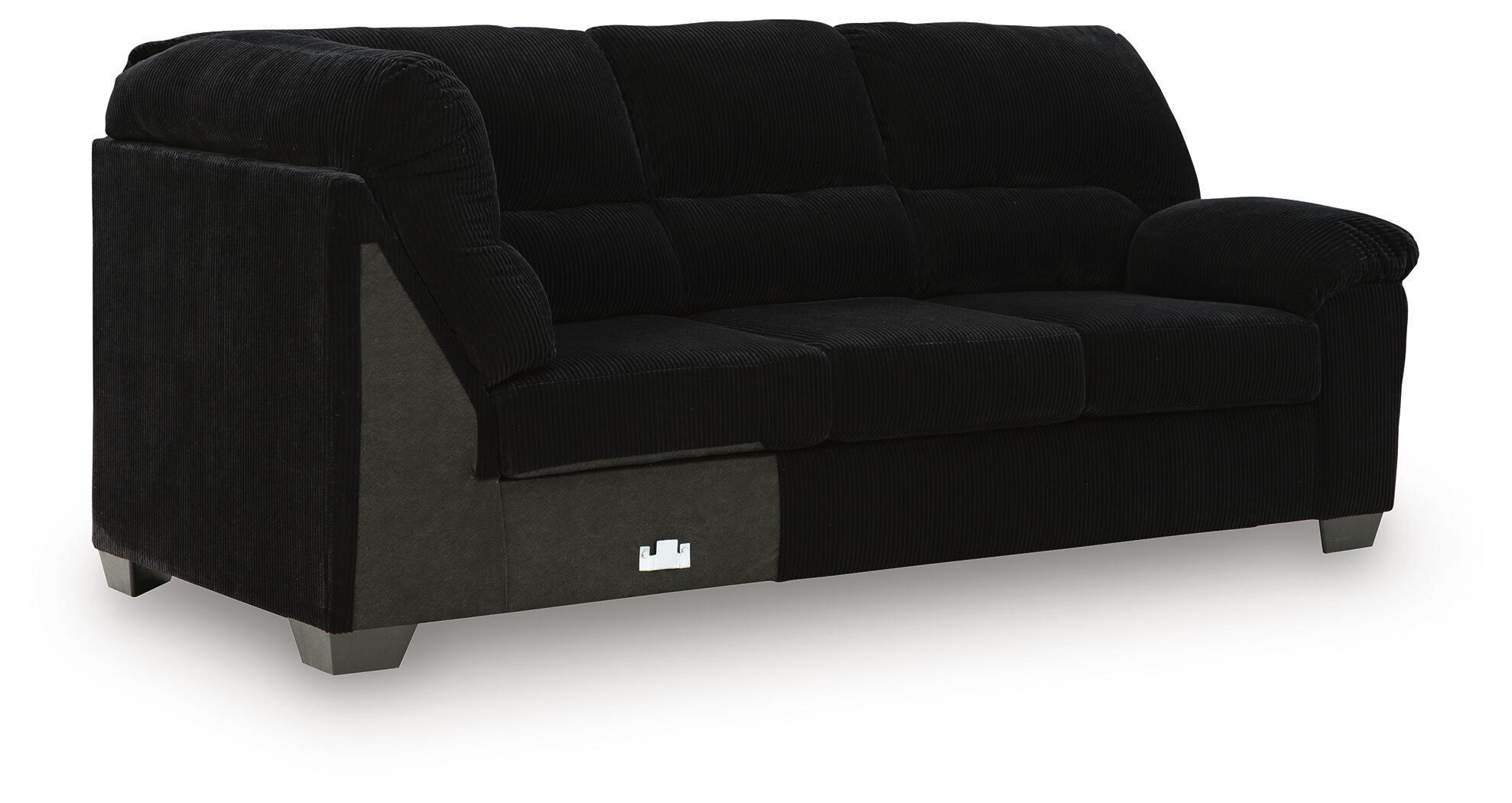 Dark fabric sofa with corner wedge, deep seat cushions and blocky legs