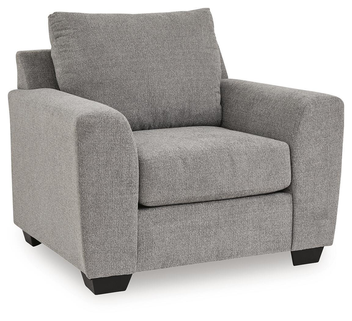 Loreo chair in gray fabric with large back cushion, rounded arms, and dark legs