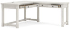 White corner desk with several drawers and open lower shelf beneath the tabletop