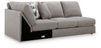 Smoke gray armless loveseat with wedge, boxy arms, black base, fabric upholstery