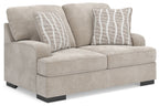 Taupe loveseat with curved back and two front seat sections, plus two striped lumbar pillows