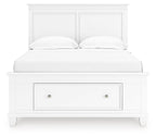 White panel bed with a single underbed drawer, curved pillows, and tall headboard