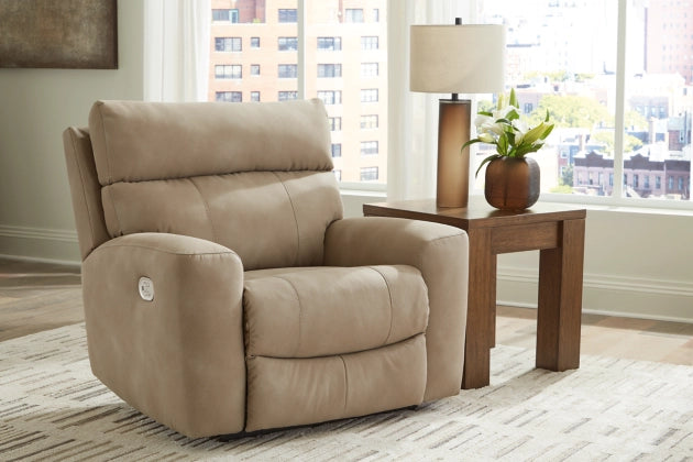 Sand beige recliner with adjustable headrest, shown near a side table