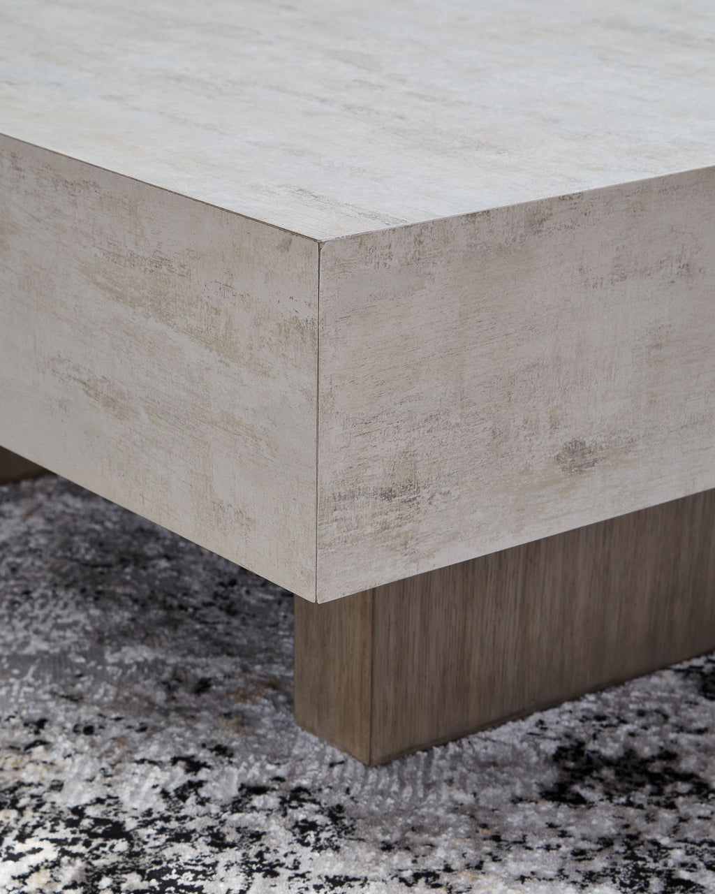 Jorlaina rectangular table corner view with white top, beveled edges, and light wood legs