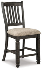 Two-tone barstool with slatted back, padded light-gray seat, dark brown frame