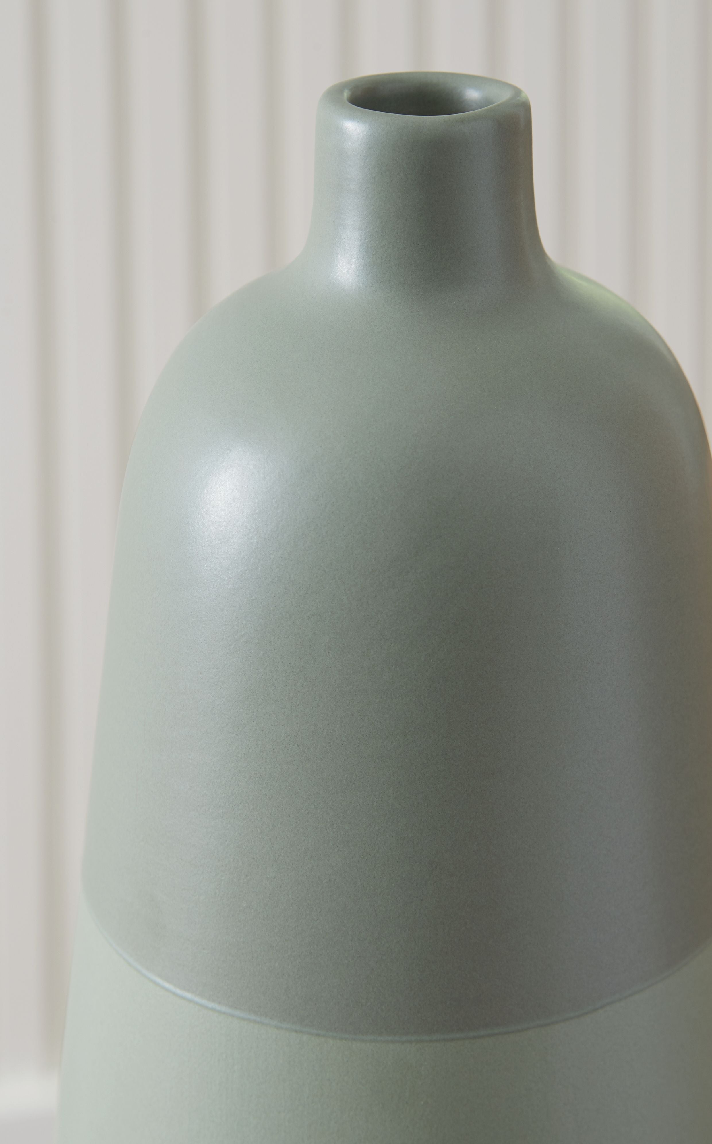 Sage green ceramic vase with rounded shoulder and short cylindrical neck