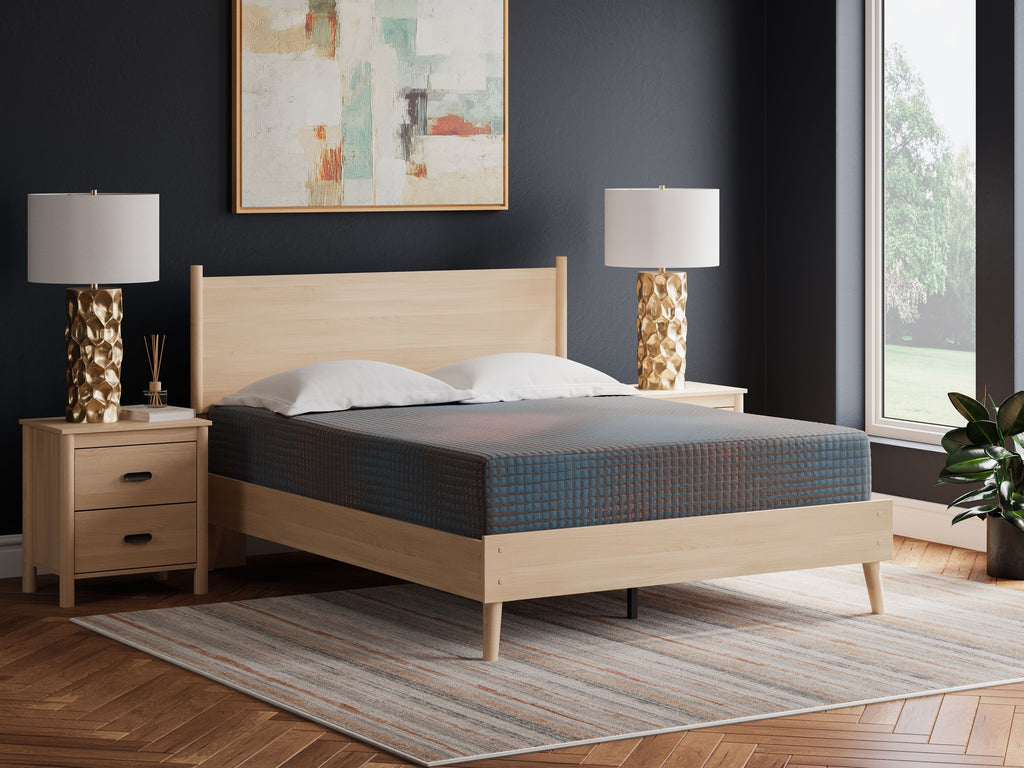 Gray hybrid mattress on light wood bed frame, upholstered top surface visible
