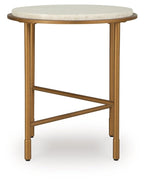 Round side table with cream stone-look top and gold metal legs with X-shaped brace.