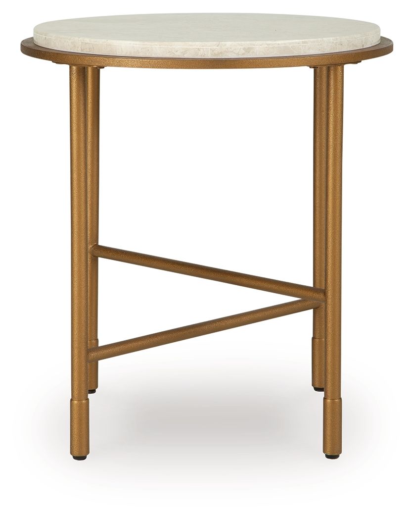 Round side table with cream stone-look top and gold metal legs with X-shaped brace.