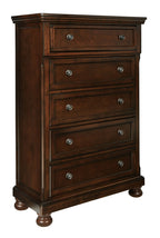 Rustic brown chest of drawers with four drawers and round metal knobs