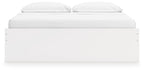 White platform bed with tall panel headboard and footboard