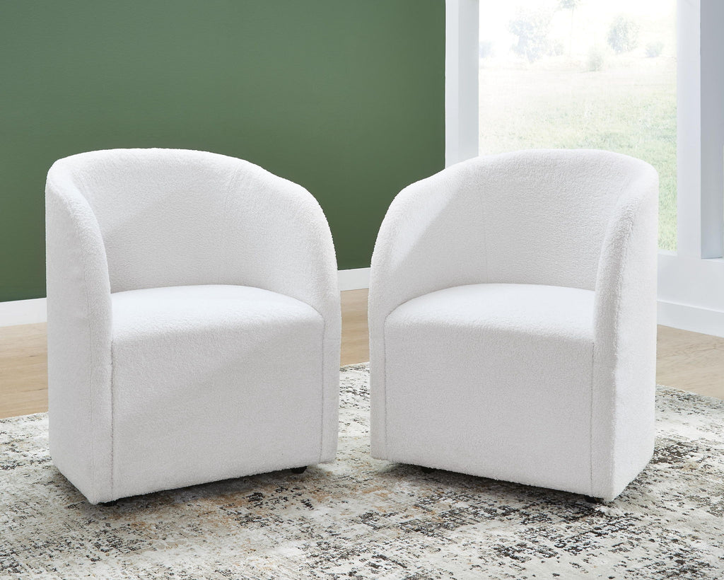 Upholstered dining arm chairs, ivory fabric, rounded back and arms, tapered legs