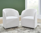 Upholstered dining arm chairs, ivory fabric, rounded back and arms, tapered legs