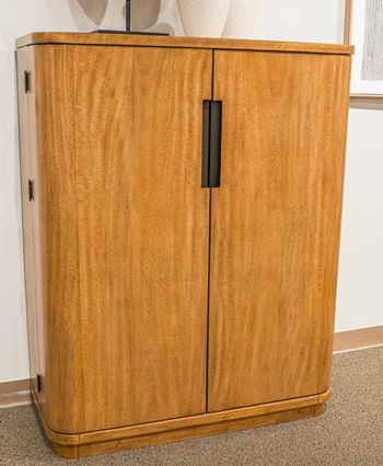 Light brown bar cabinet with two doors and vertical black bar-style handles