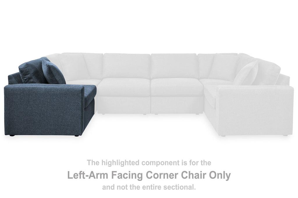 Ink blue fabric left-arm facing corner chair with deep seat and two back cushions.