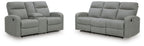 Light gray reclining loveseat with padded arms, tufted seat and black base