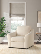 Beige upholstered lounge chair with tall back cushion and track arms
