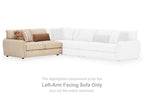 Left-arm facing sand sofa section with decorative pillows, upholstered in light beige fabric.