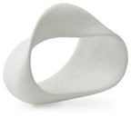 White abstract sculpture with a circular cutout, smooth stone-like finish.