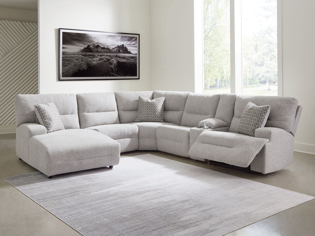 Pewter power reclining sectional sofa in living room setting with chaise sections