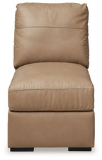 Toffee armless chair with tall backrest, plush seat cushion, visible seams, black base