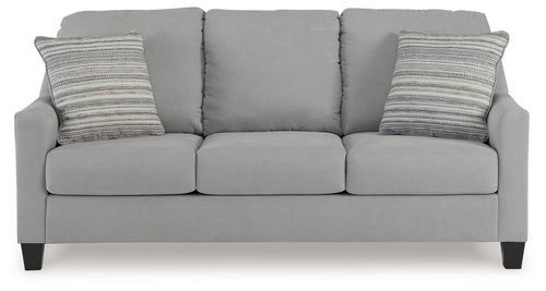Light gray queen sofa sleeper with three seat cushions and two striped throw pillows
