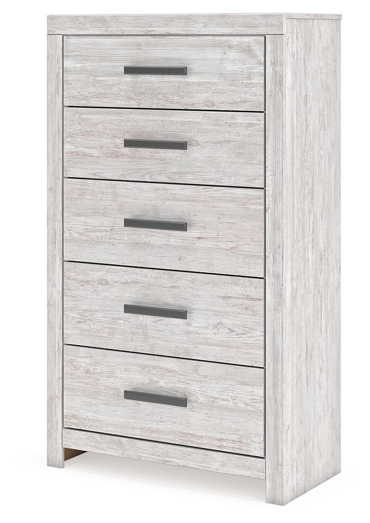 Whitewash five-drawer chest with dark bar pulls and visible side panel, angled view