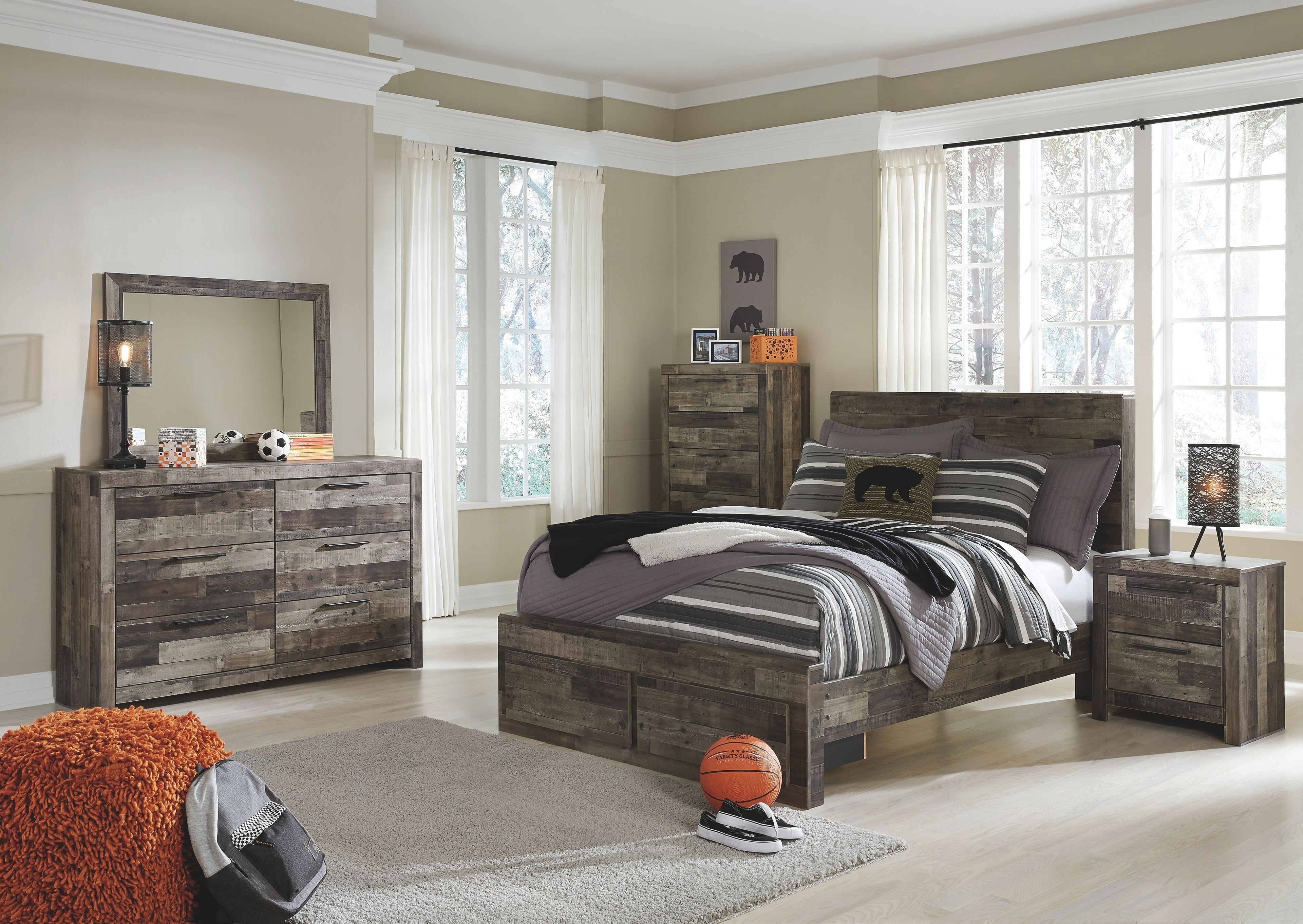 Youth panel bedroom set showing dark wood bed with striped bedding and matching nightstand