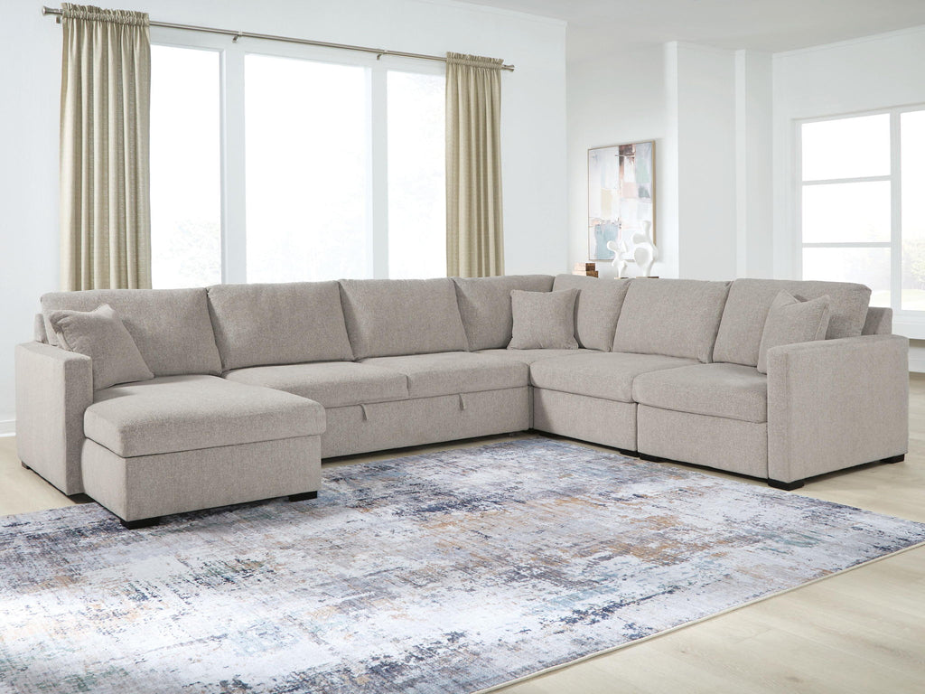 Gray sectional sofa with chaise corner and ottoman-style end seats