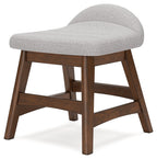 Light gray upholstered home office desk chair with curved cushioned seat and back