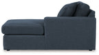Dark blue corner chaise with low armrest and stacked back cushions