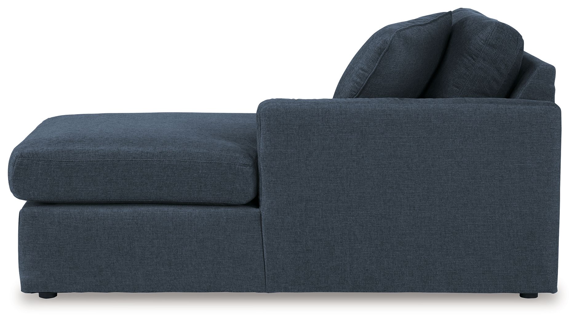Dark blue corner chaise with low armrest and stacked back cushions